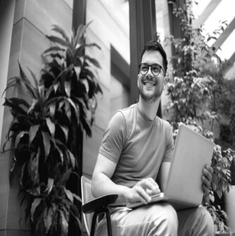 happy young man on laptop