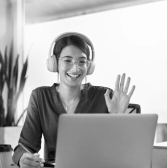 young woman using laptop to host video call