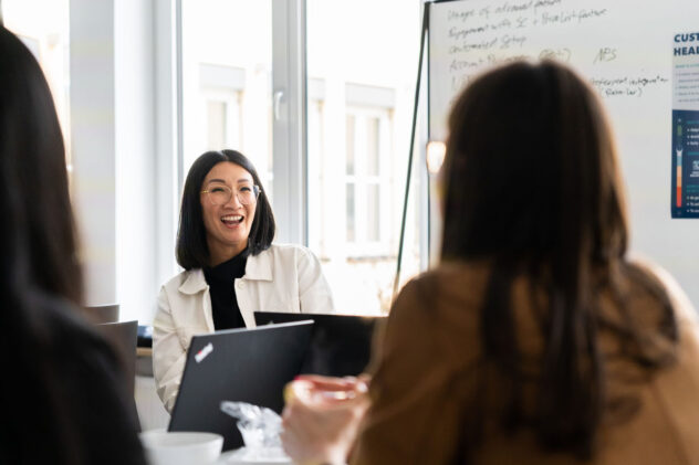Person laughing in business meeting